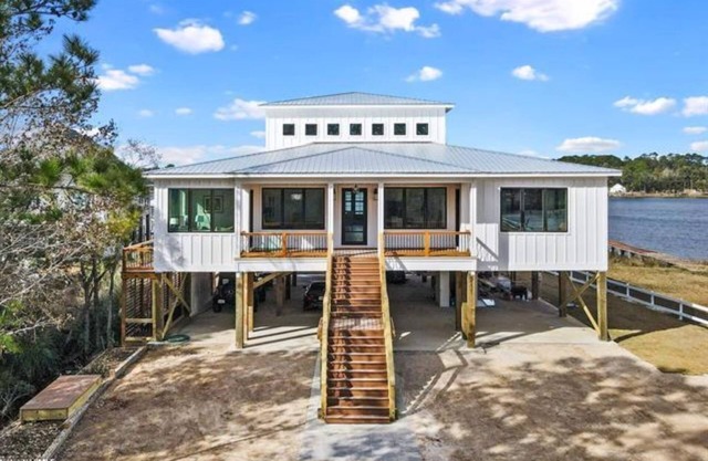 New, bayfront custom home with pier for your boat plus outside deck