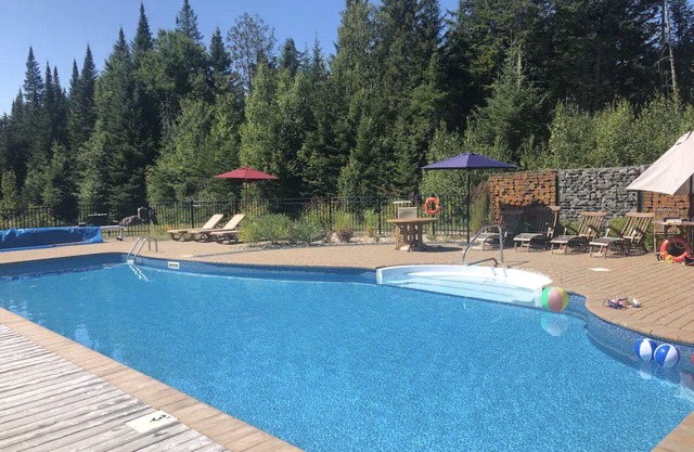 Newly renovated log home with private spa and lake access.
