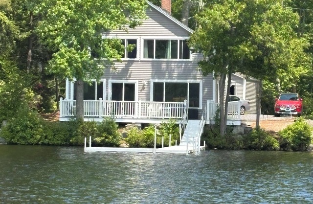 Newly renovated lake front home with dock and sunset views of Laurel Lake