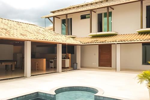 NossoApê Guarua: Piscina | Churrasqueira | Ar-condicionado