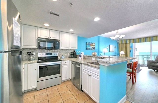 Oceanfront Bliss – Bright Blue Condo with Balcony & Beach Views