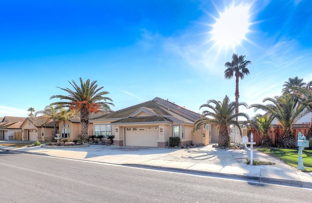 OPEN FLOOR PLAN WITH SIDEYARD PARKING AND WONDERFUL REAR DECK WITH OVERHANG