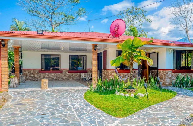 Palm-lined paradise with a pool, wood stove, & mountain views - dog-friendly