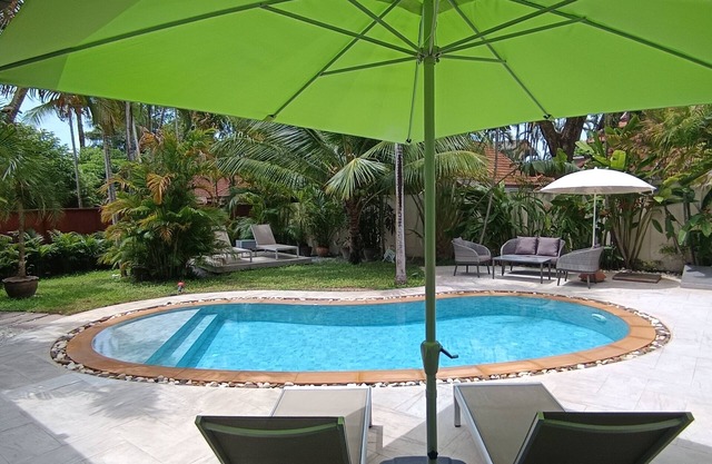 Paradise Island Villa 3 features a private swimming pool in a luxurious tropical park.
