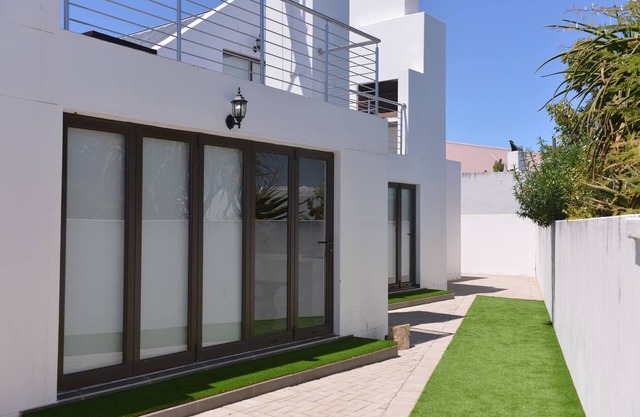 Pelican Cove is a Modern 4-Bedroom Holiday Home in Langebaan with some Sea Views