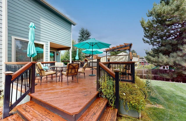 Private home with fenced yard, deck, fireplace, home office, & great location