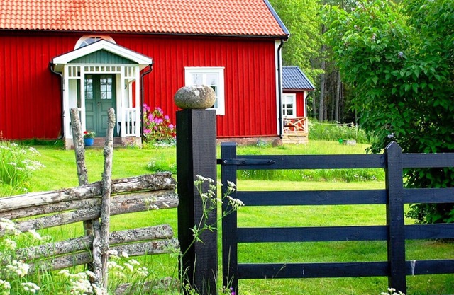 Red and white holiday home near the forest and not far from the lake and swimming facilities