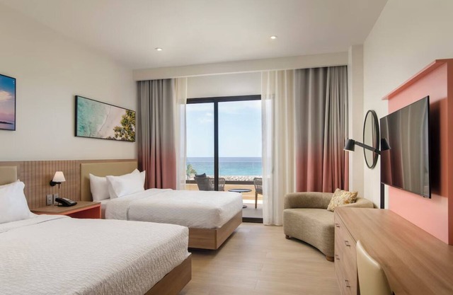 Relax in a Modern Room w/Pool Access, Stunning Ocean Views & Free Parking