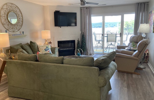 Relax on your screened in balcony overlooking the Lake. Two Golf Courses nearby.