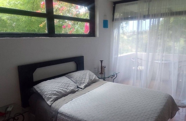 Room with balcony and view