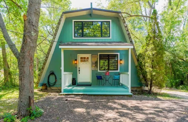 Rustic Riverside A-Frame Retreat: Secluded Charm.