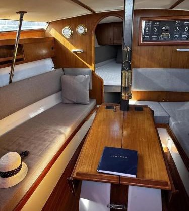 Sailingboat, next to ferry