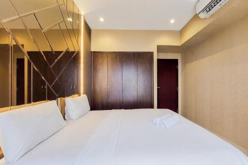 Scenic and Comfortable 2BR Branz BSD City Apartment By Travelio