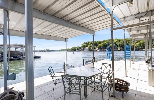 Secluded lakefront home with private dock, multiple decks, gym, swim platform