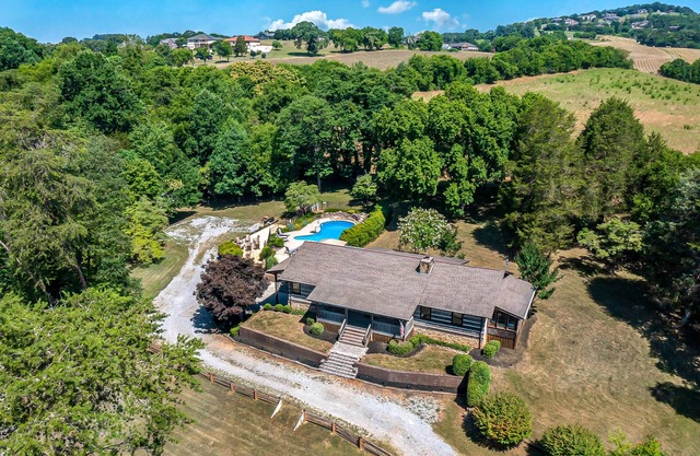 Serene cabin with pool, hot tub, game room, fireplace, & free attraction tickets