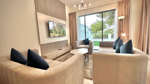 Serene Green Escape and Stunning Views in DAMAC Hills 1 by Bhavan Vacation Homes