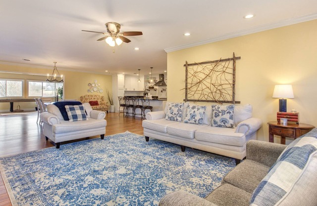 Serene lake views featuring a private dock, sun deck + spacious fire pit