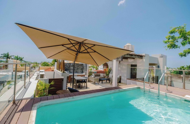 Serviced 1-Bedroom Apartment · Rooftop BBQ + Pool · Bikes · Security #3