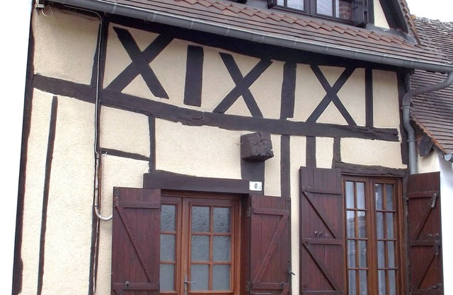 Small Half-timbered norman house in village with all convenience store
