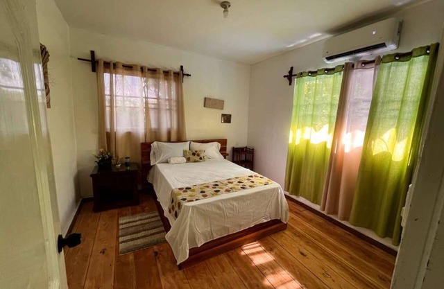 Spacious 6-bedroom villa in Tranquil Monseñor Nouel with AC