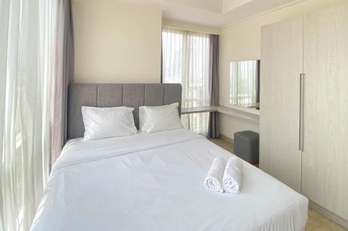 Spacious and Elegant Designed 3BR at Menteng Park Apartment By Travelio