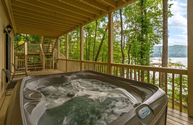 Spacious Lakefront home with private dock, hot tub, grill & pool table