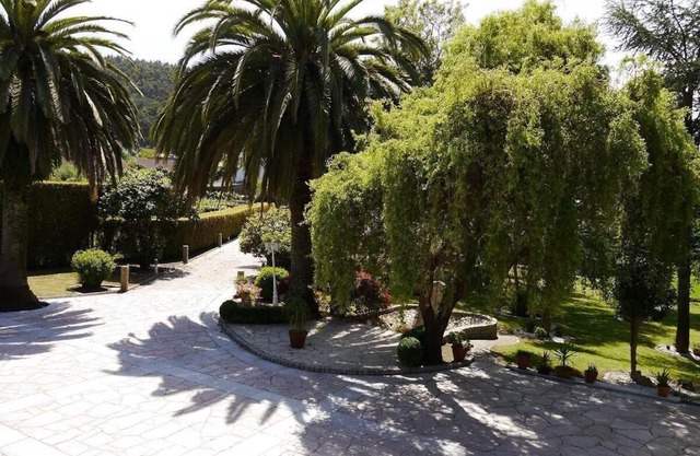 stone chalet with pool and garden areas