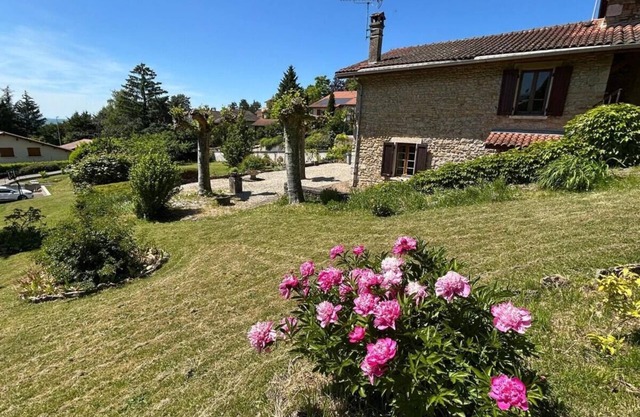 Stone house on the heights of Ambérieu. View of the Bugey mountains