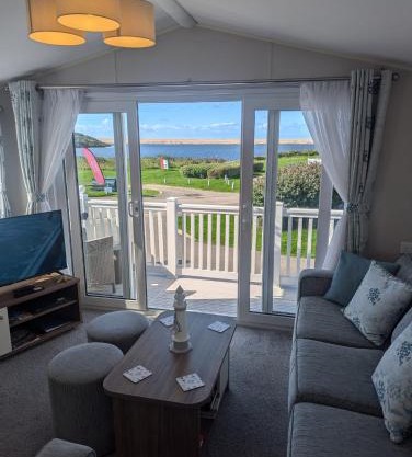 STYLISH HOLIDAY HOME WITH UNINTERRUPTED VIEWS OF THE FLEET LAGOON ON Haven LITTLESEA HOLIDAY PARK