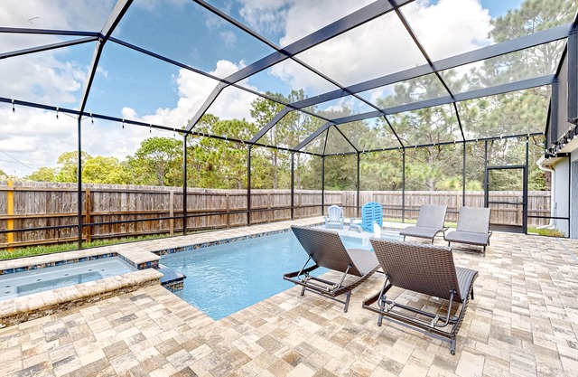 Summerfield home with a fenced-in yard, pool, hot tub, & games