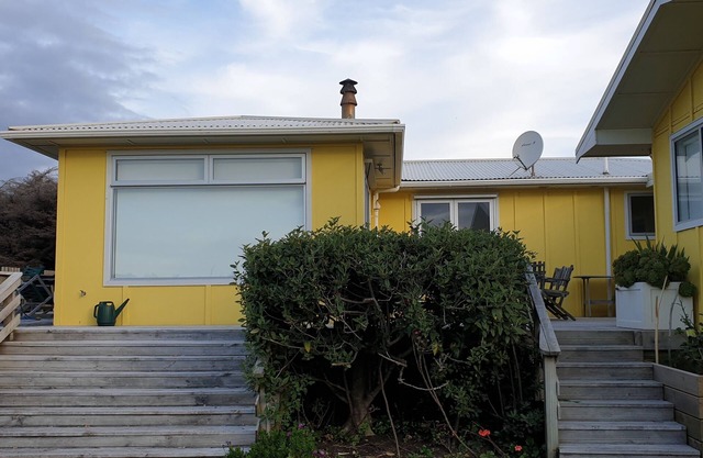 Sunny bach on beachfront with heaps of room and lots to do