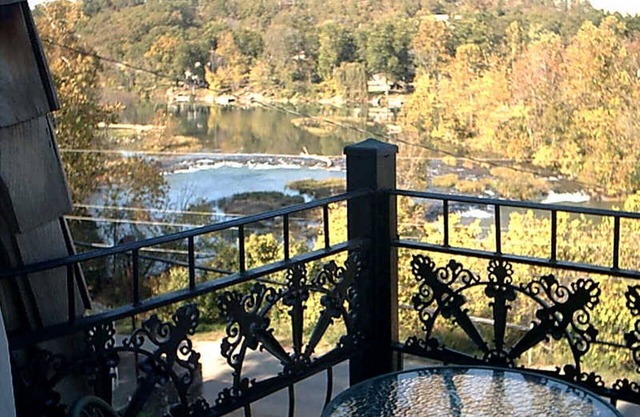 The charming French Chateau overlooks the beautiful falls of the Spring River
