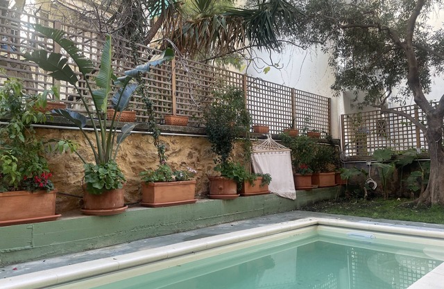 The pink frog apt in the center with private pool
