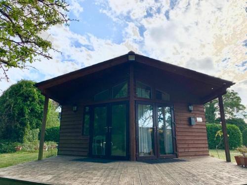 The Reading chalet with gardens and koi pond