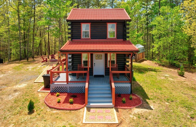 Tiny cabin next to a small farm-fire pit, hot tub, grill, disc golf, cornhole