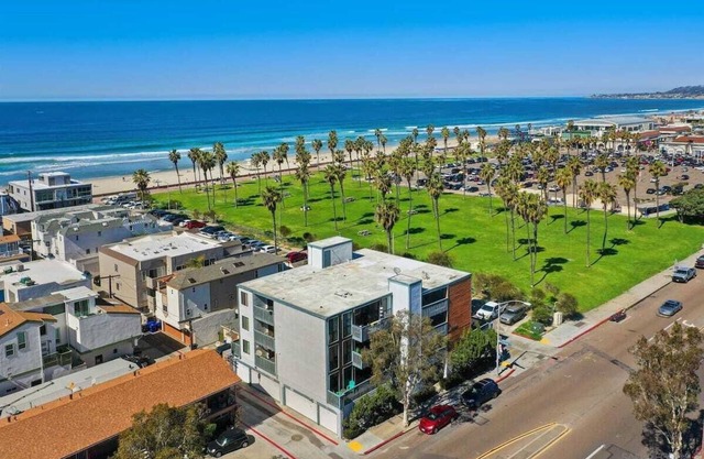 Top Floor Corner Unit Steps to Ocean or Bay !