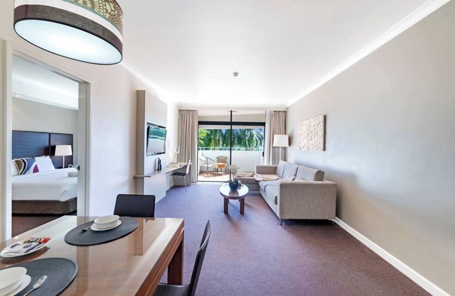 Towering Palms Seaside Balcony with Resort Pool