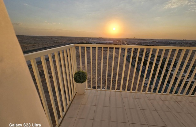 Tranquil 2BR Haven, Open Kitchen, Balcony view near the community Malibu Bay.