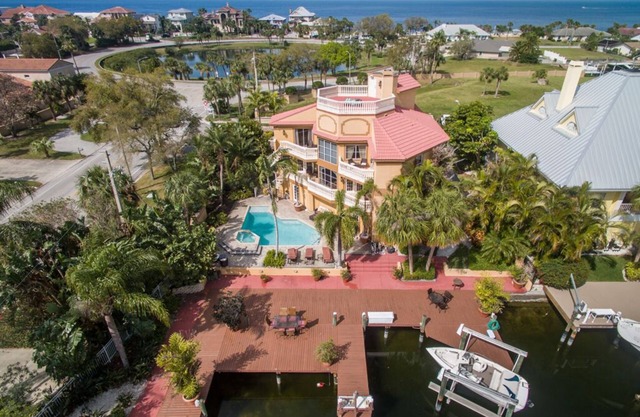 Tropical Waterfront Resort Home with Marina, Kayaks, Piano, Game Room