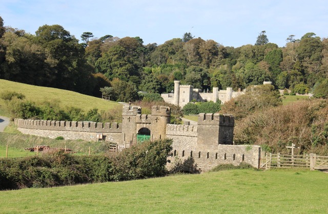 Turreted gatehouse to the historic Caerhays Castle located on the beach on the south Cornish Coast