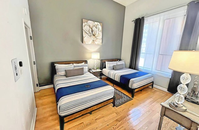 UNIT #203 2-bedroom/1-bath 500 sq. ft suite with Parking & 4 Beds including a full kitchen - Washer/Dryer