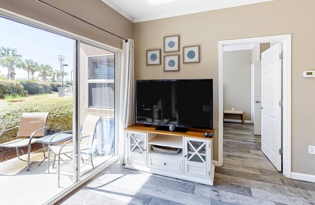 Updated, beachside condo with dual suites, balcony & pool - walkable locale