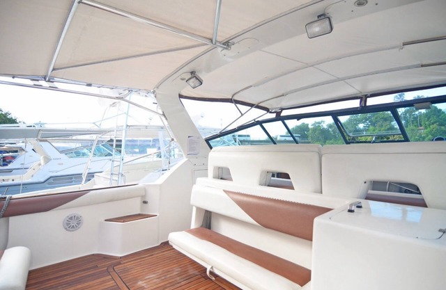 Very luxurious accommodation on a boat, room, bathroom and fine wood finishes.
