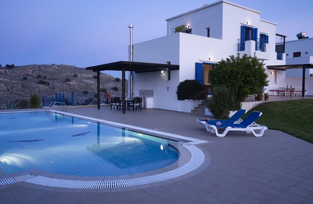 Villa for six. Large pool, sea views, lawned gardens. Near beach and amenities.
