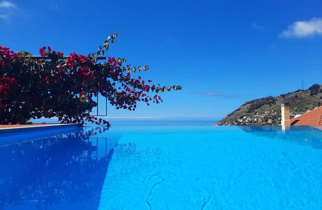 Villa with infinity pool and games room overlooking the sea