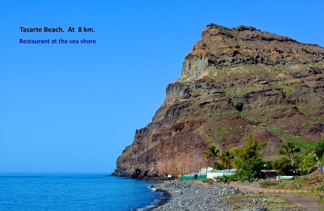 Villa with private pool in a valley under the sun and palms