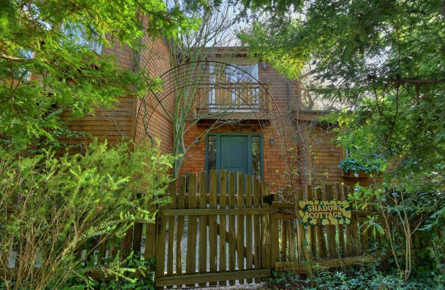 Walk to downtown and the beach. Hear the ocean from this charming home.