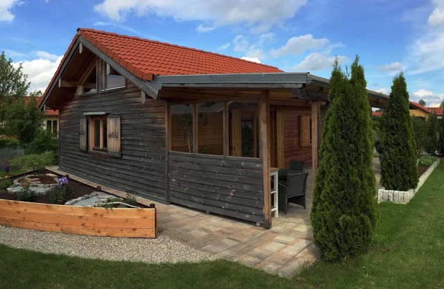 Warmly decorated wooden house in the countryside near the lake