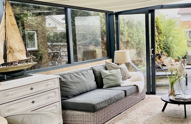 Waterfront home with fine sunroom and fireplace