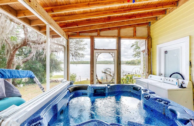 Waterfront home with private hot tub, arcade room & firepit - dog-friendly